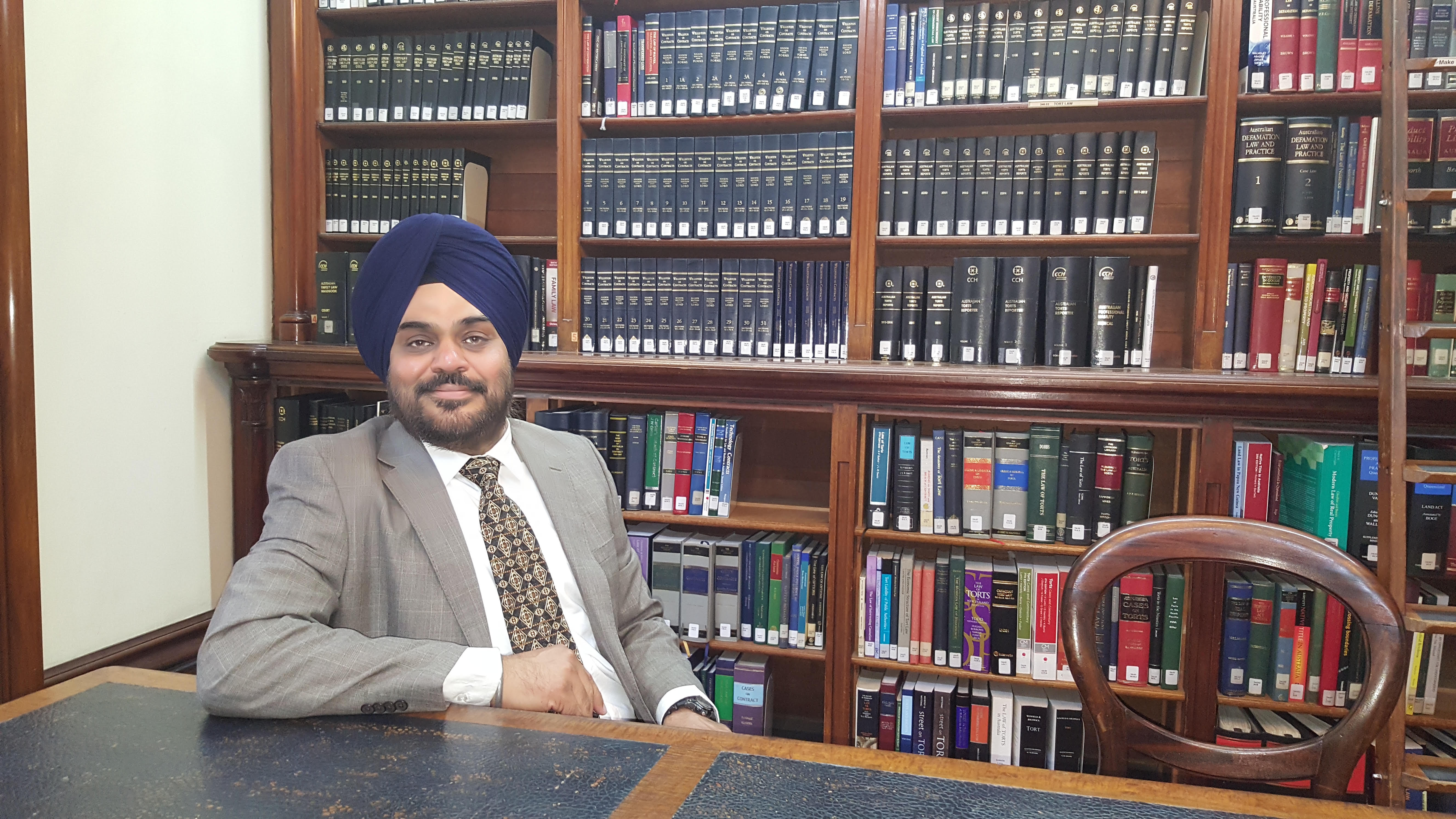 Amarinder Singh Gandhi, Principal Solicitor, in his study